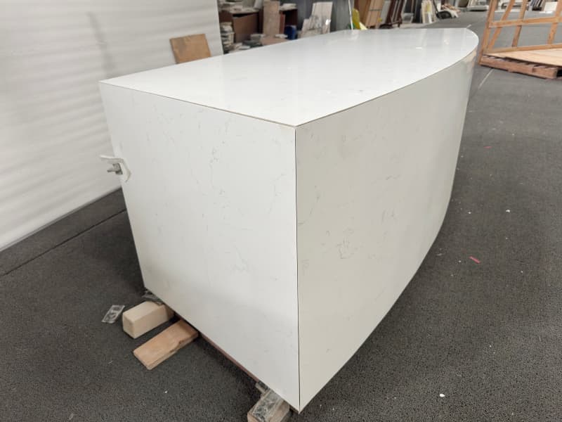 Curved counter with wooden cabniet