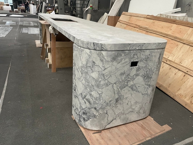 Custom Curved Stone Front Desk