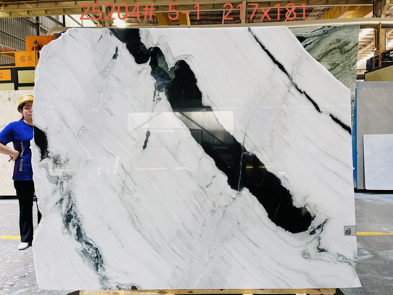 Raw Panda White marble slab with striking black veins.