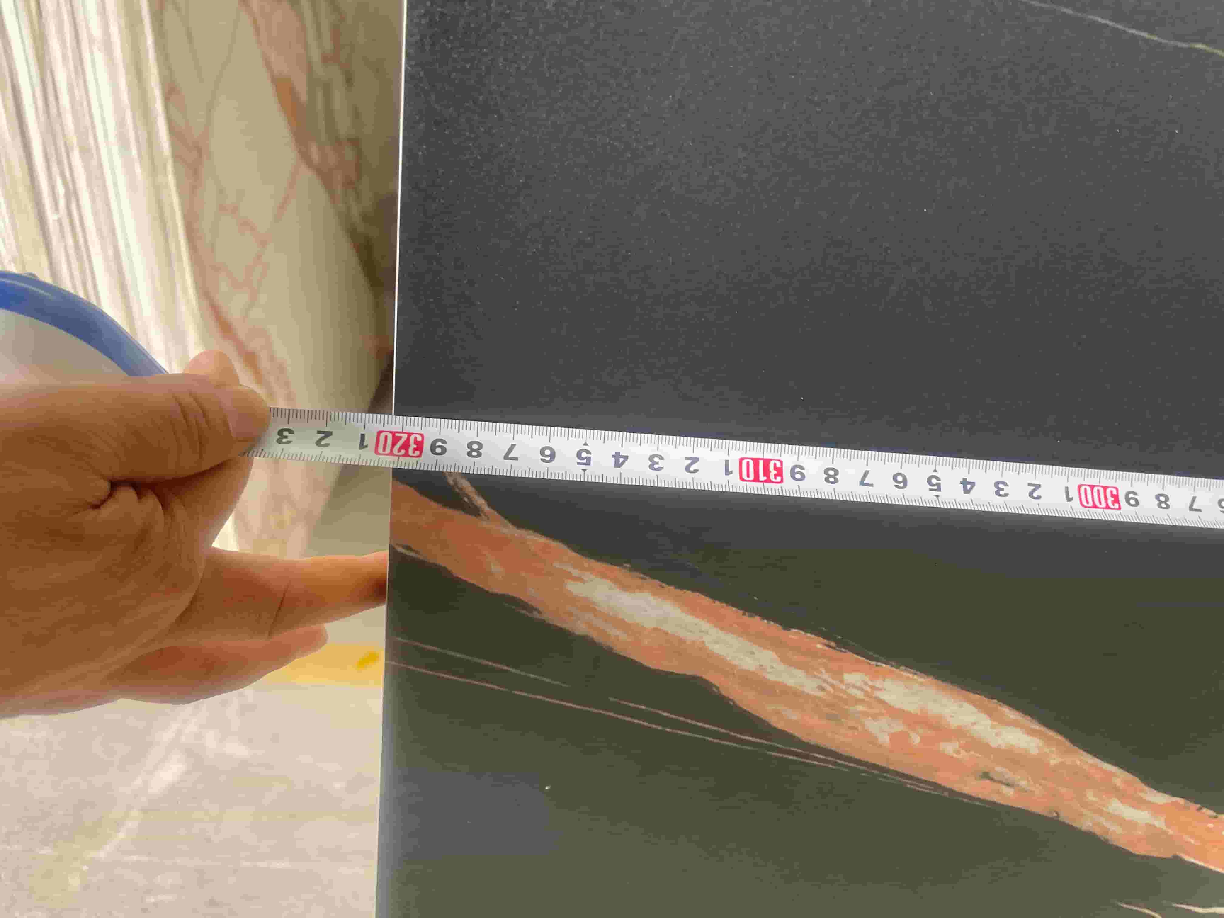 Marquina sintered stone slab length measurement before shipment