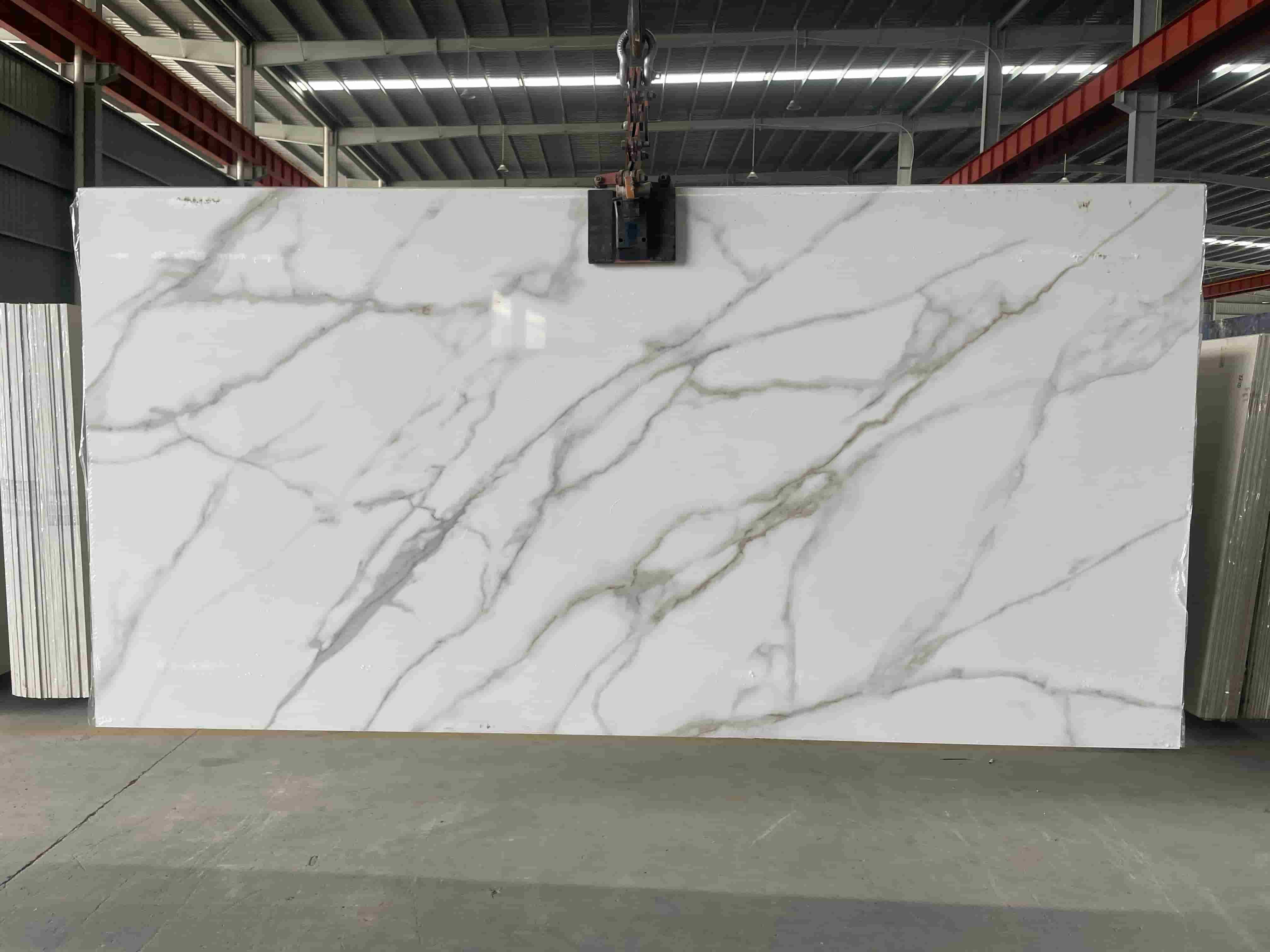 Calacatta White sintered stone slab with gray green veining before fabrication