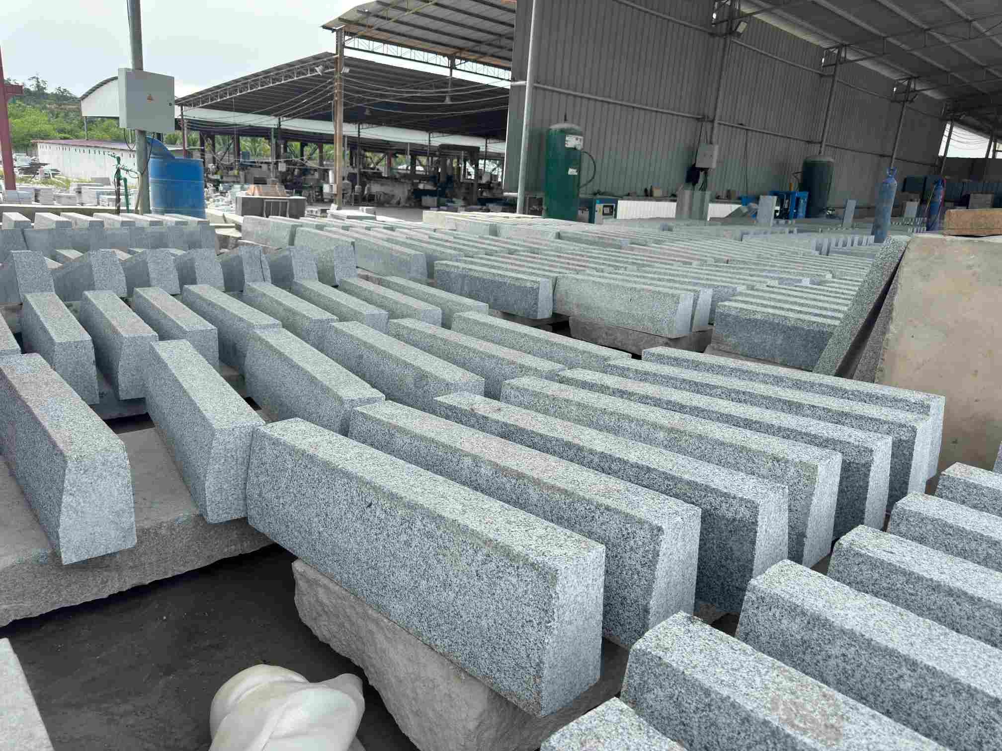 Tema Grey granite stair treads with thermal tops and rock-faced front edges