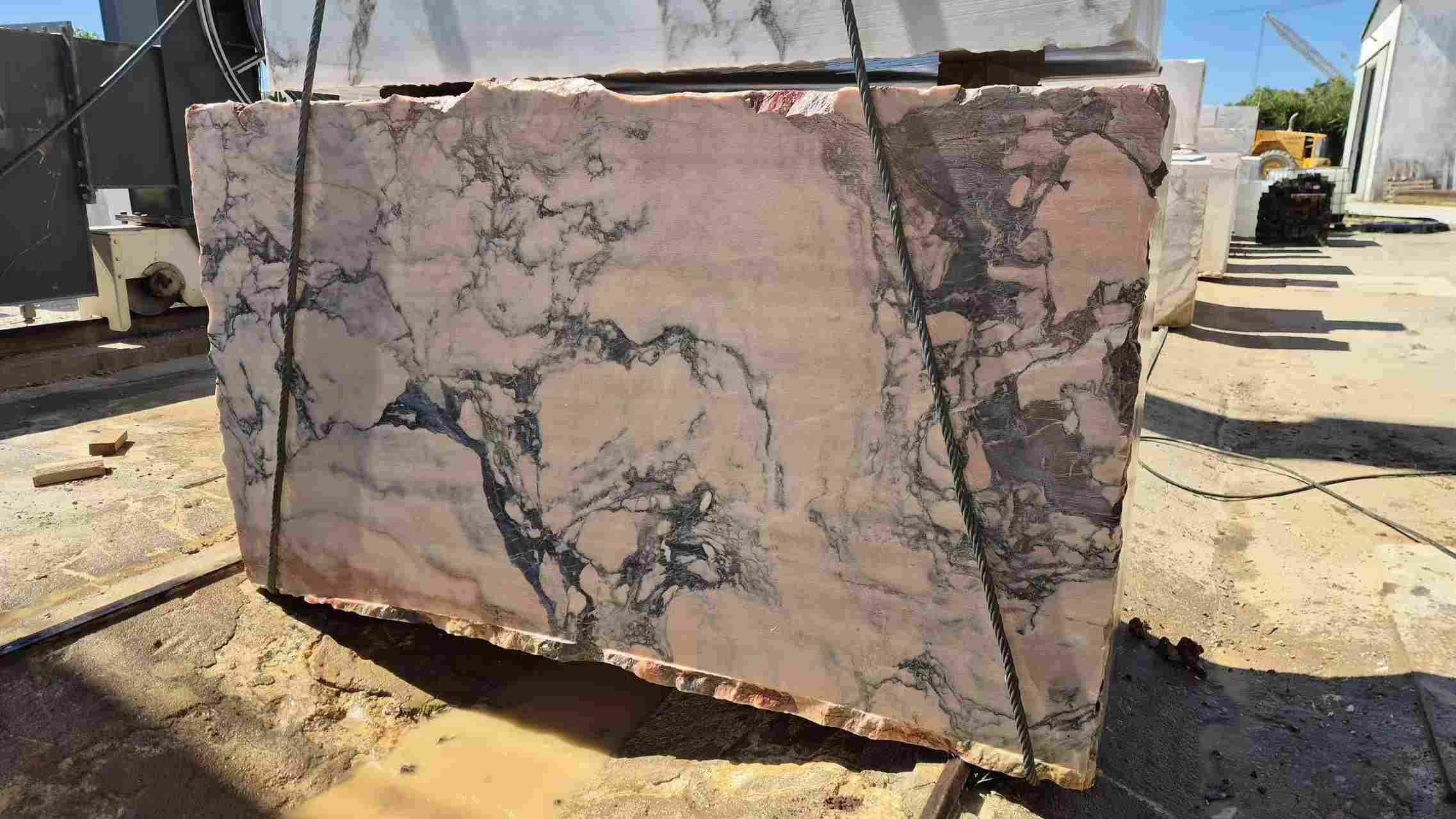Heavy lifting equipment for Calacatta Viola marble blocks