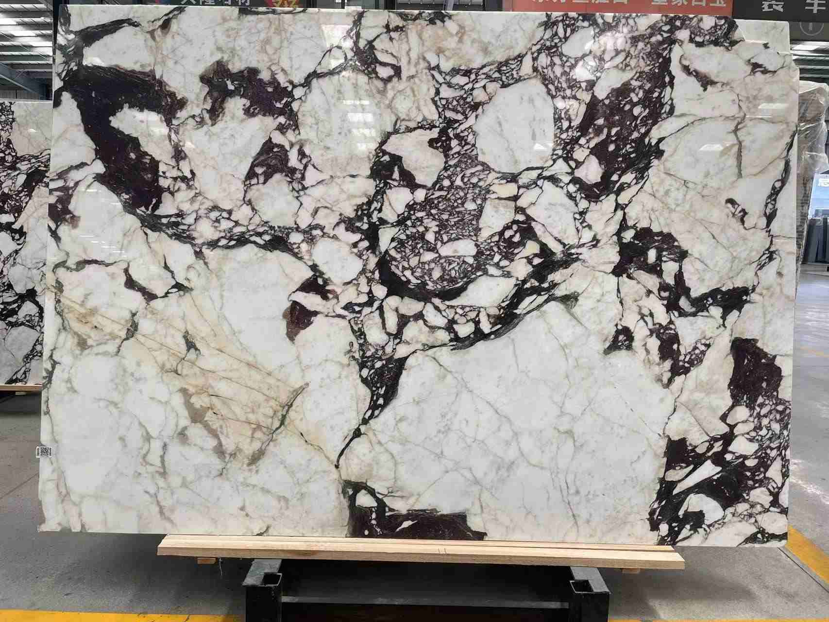 Italian Calacatta Viola marble slab with larger white areas and less burgundy