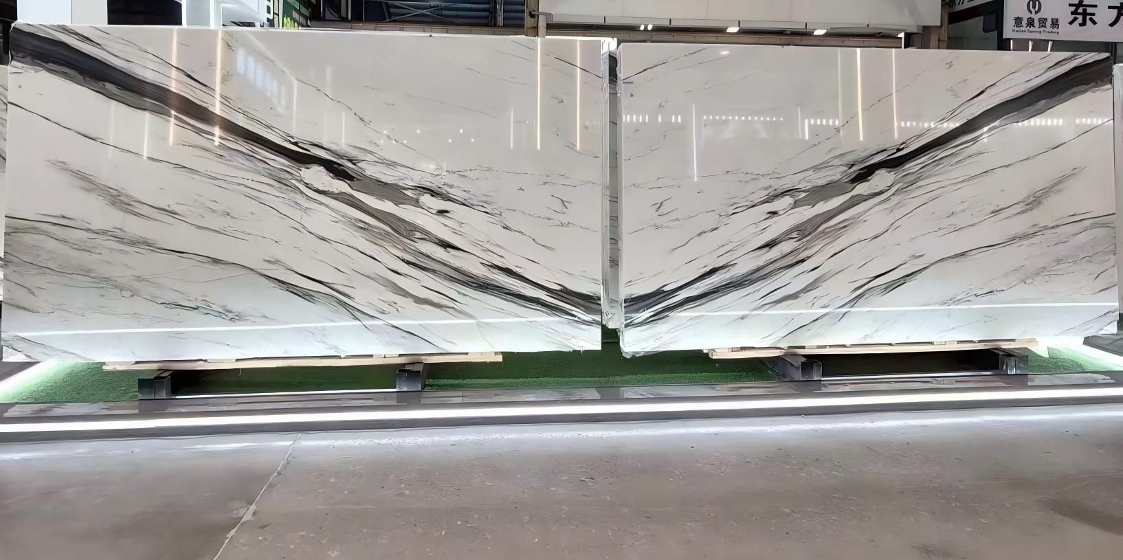 Bookmatched Oriental Calacatta White Marble Slabs Bookmatched Oriental Calacatta White marble slabs with bold black movement across a clean white background